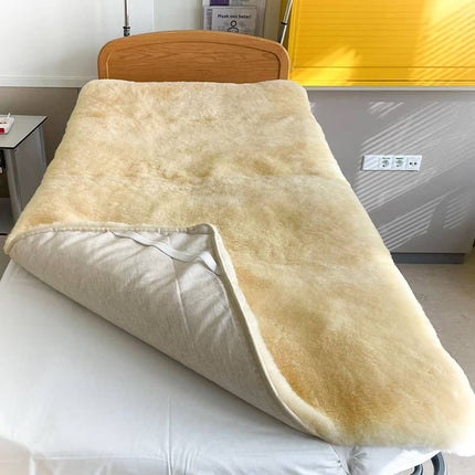 Medische onderdeken van schapenvacht om op uw matras te leggen