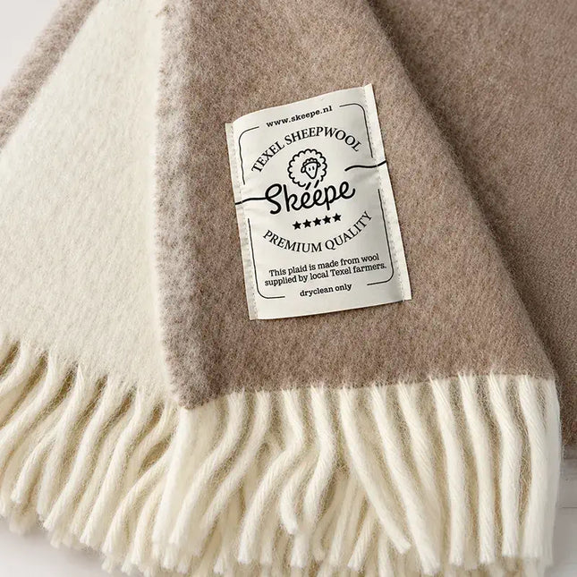 beige wollen deken skeepe